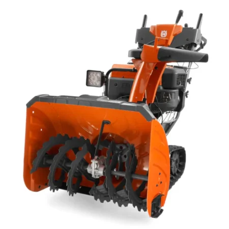 Fraise à neige Husqvarna ST 427T avec chenilles, turbine 4 pales, transmission hydrostatique et démarrage électrique, idéale pour grandes surfaces et pentes